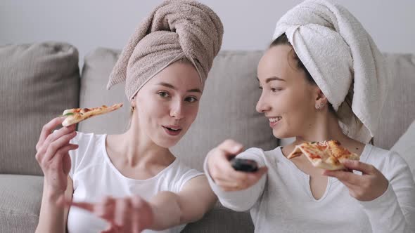 Girls Friends Eats Pizza and Watching TV at Home