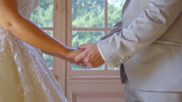 Bride and Groom Hand in Hand