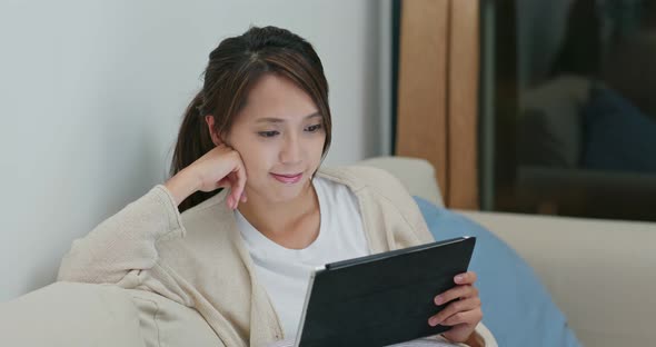 Woman use of tablet computer at home