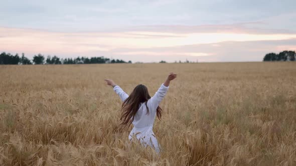 Pretty Child in the Wheat Field Happy Young Girl Play in the Field at Sunset Happy Kid Playing in