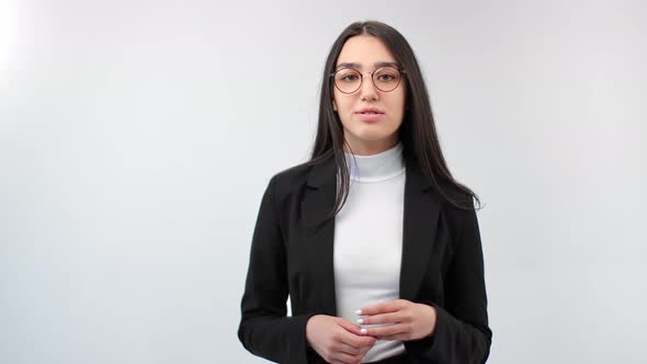 Adorable Business Woman in Glasses Talking and Explaining Isolated