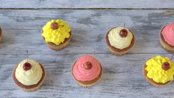 Rows of Cupcake on Wooden Background