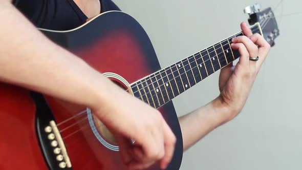 Man Playing An Acoustic Guitar