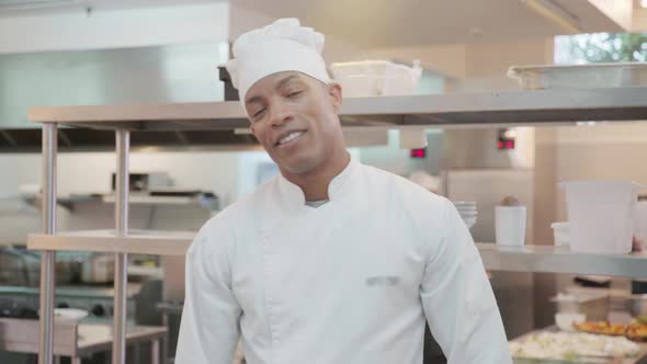 Chef standing in commercial kitchen