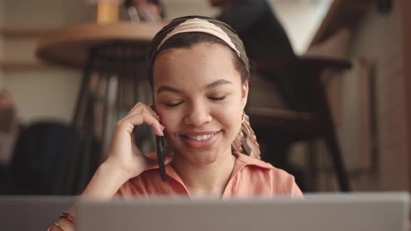 Female Freelancer Working in Cafe