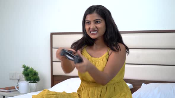 Indian gamer girl playing a tensed match