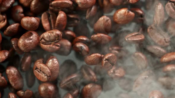 Super Slow Motion Detail Shot of Coffee Beans and Smoke Background at 1000Fps