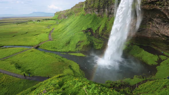 Seljalandsfoss Waterfall in Iceland with a Rainbow