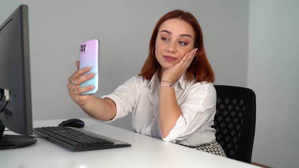 Business Woman Taking Selfie While Working 4K