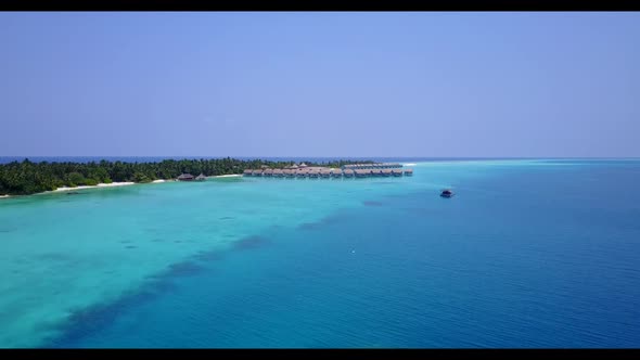 Aerial drone tourism of relaxing bay beach adventure by blue sea and white sand background of a dayo