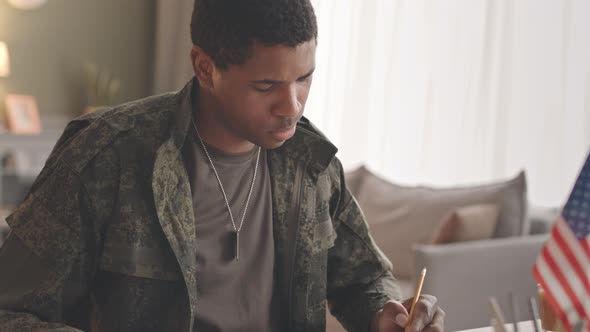Black Army Officer Working from Home alt