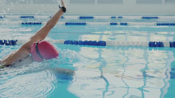 Skillful Female Swimmer Trains in the Pool