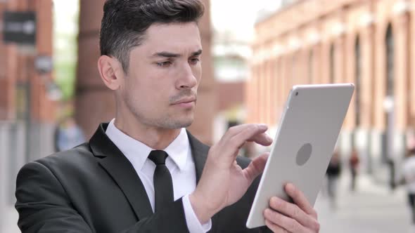 Businessman Using Tablet Outdoor