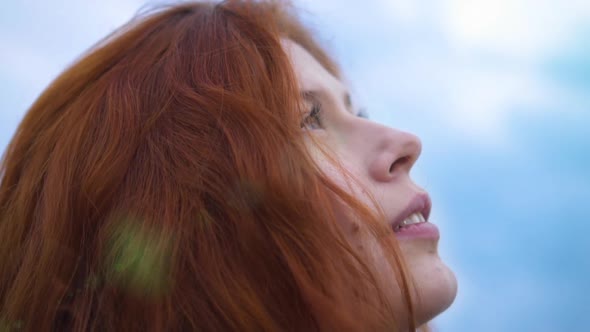  Beautiful Redhead Woman Exploring Spirituality Looking up Praying Сlose up Portrait 