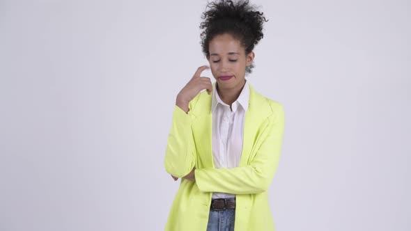 Young Serious African Businesswoman Thinking and Looking Down