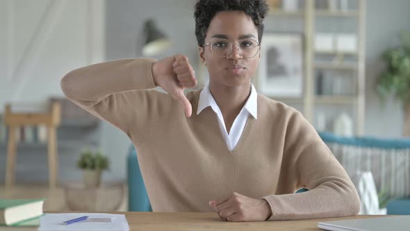 Working African Girl Showing Thumb Down