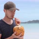 Man Drinking Coconut On Tropical Beach - VideoHive Item for Sale