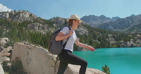 Happy Traveler Woman Hiking To Cinematic Scenic Blue Mountain Lake. Feel Freedom