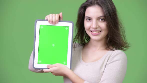 Young Happy Beautiful Woman Smiling While Showing Digital Tablet