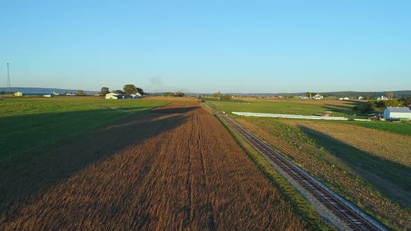 A Drone View of Crops Waiting to be Harvested as a Stream Passenger Train Approaches During the Gold