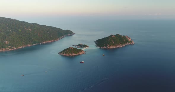 Aerial Green Island Ocean Seascape Group In Sea Ripple View