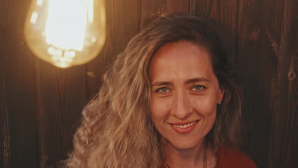 Woman Portrait in Light of Incandescent Lamp