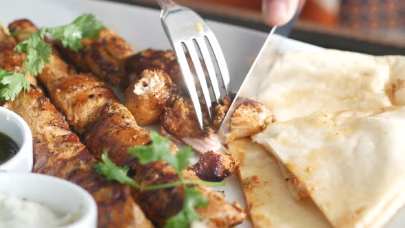 Seekh Kabab Naan Bread and Sauce on a Plate