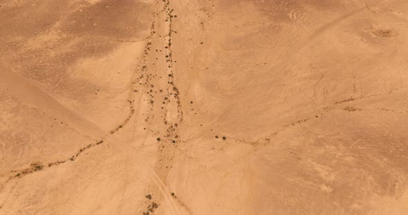 Dry Desert landscape, low pass aerial view.