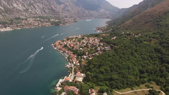 Town of Prcanj on the Shore of the Kotor Bay at the Foot of the Mountains