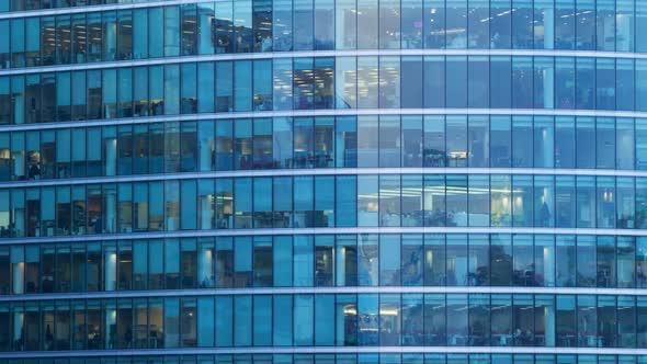 Day to Night Timelapse of The Exterior of An Office Block at Night