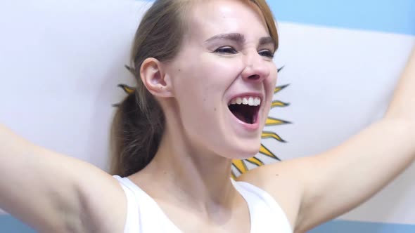 Argentinian Young Woman Celebrates Holding the Flag of Argentina in Slow Motion