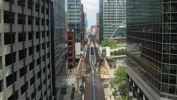 Epic Aerial Cinematic Shot Between Skyscrapers Above Skytrain in New York