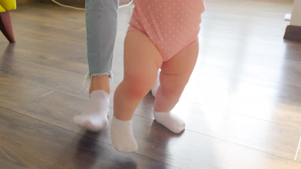 Close Up of a Tracking  Footage of Feet of Little Girl Baby Walking Barefoot