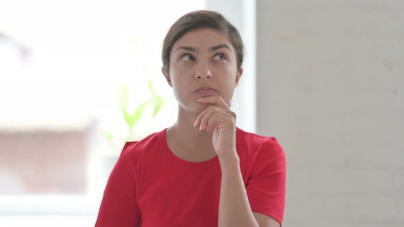 Portrait of Pensive Indian Woman Thinking New Plan