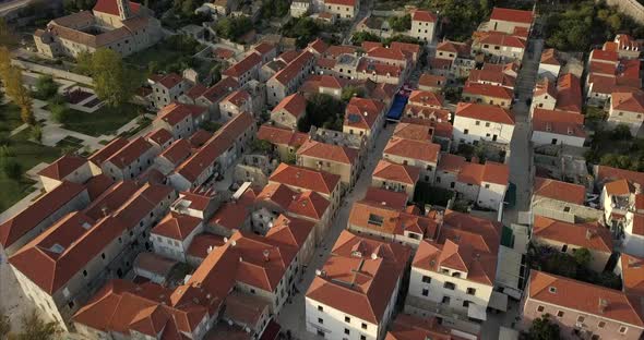 Close up Aerial shot of Ston an ancient walled city in Croatia. camera pans up to show a wide view o