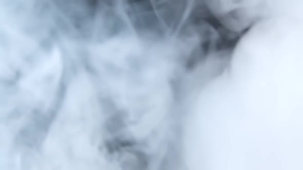 White Smoke Floating Through Space Against Black Background. Mist, Smoke , Vapor, Fog Effect. Slow