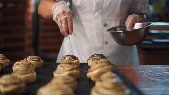 Woman making cinnabon in the kitchen