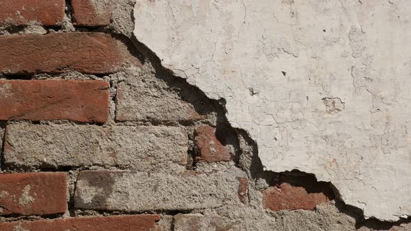 Destructed  wall white cement plaster 4K 2160p 30fps UltraHD footage - Old  brick  building facade  