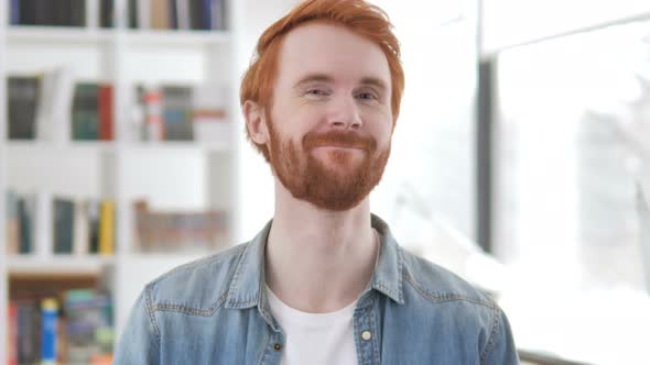 Casual Redhead Man Shaking Head in Acceptance