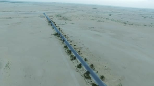 Flying With Drone Forward Blocked Road With Sands In Desert With Arabian desert in Dubai