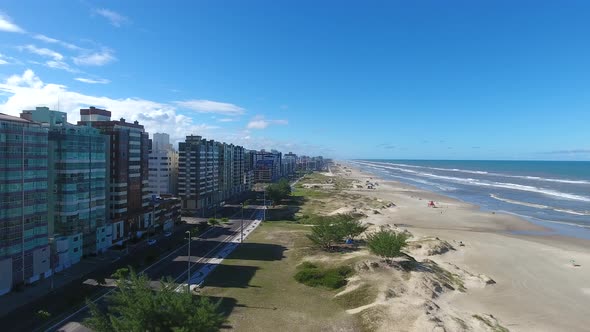 Beach and city, aerial scene in 4k, Capao da canoa city, south of Brazil.