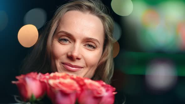 Closeup Face of Joyful Festive Girl with Heap of Fragrance Rose Flower