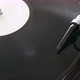 Close up footage of a turning vinyl and a spherical needle on it - VideoHive Item for Sale