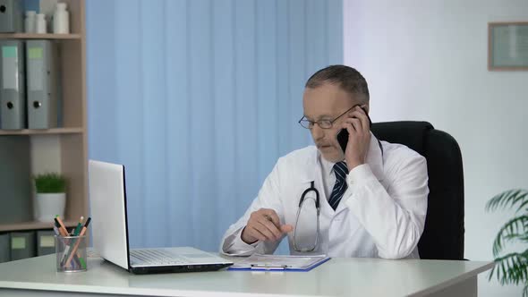 Doctor Discussing Results of Patients Tests, Making Recommendations by Phone