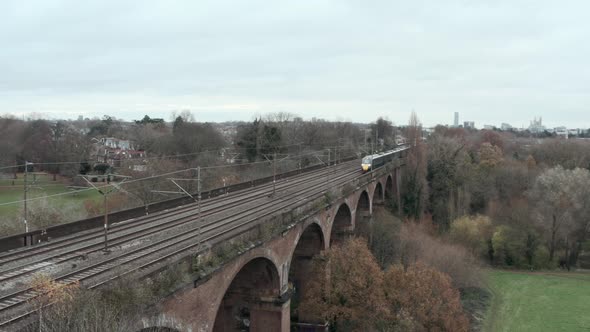 Stationary aerial shot of Great western railway javelin high speed train over Wharncliffe viaduct Lo