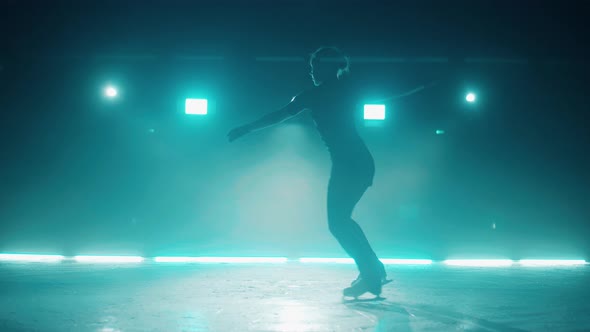 Female Skater is Doing Spins on Ice