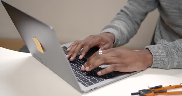 Image of African American Businessman Working on His Laptop