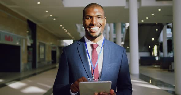 Businessman looking at camera in a modern office 4k