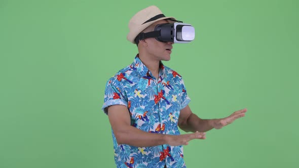 Happy Multi Ethnic Tourist Man Using Virtual Reality Headset