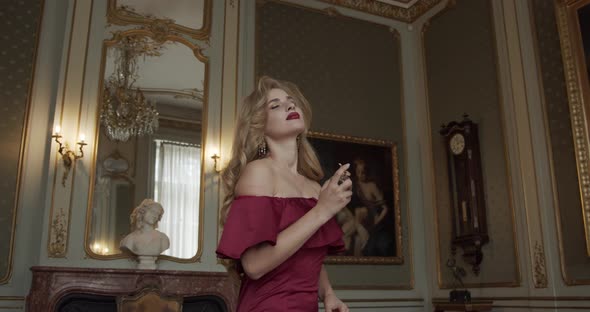 Seductive Girl Enjoys Expensive Perfume In An Elegant Palace